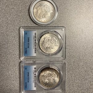 Three Morgan coins for sale. 1904, 1884, 1894.